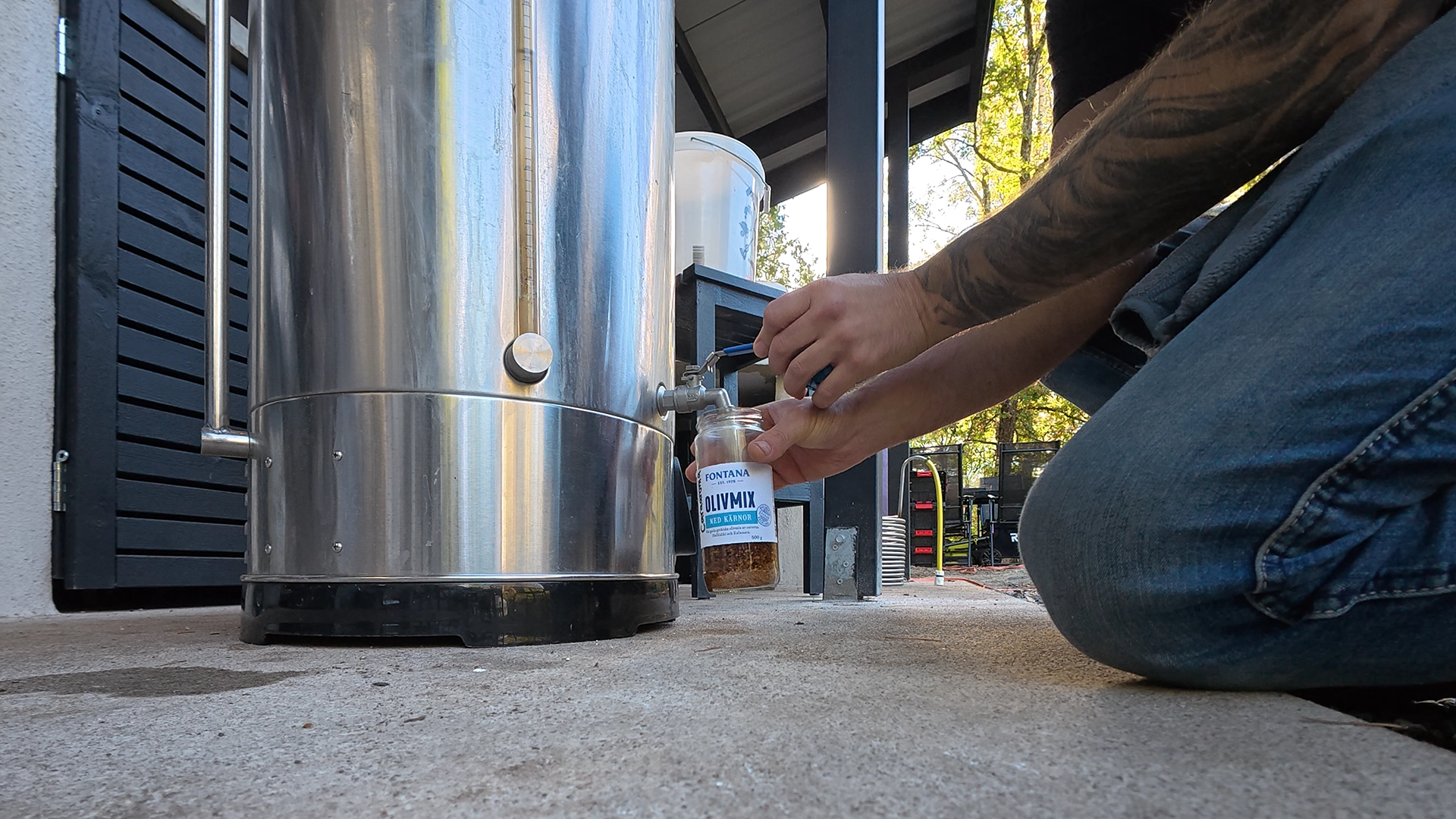 Pulling wort from the brew kettle into a small jar