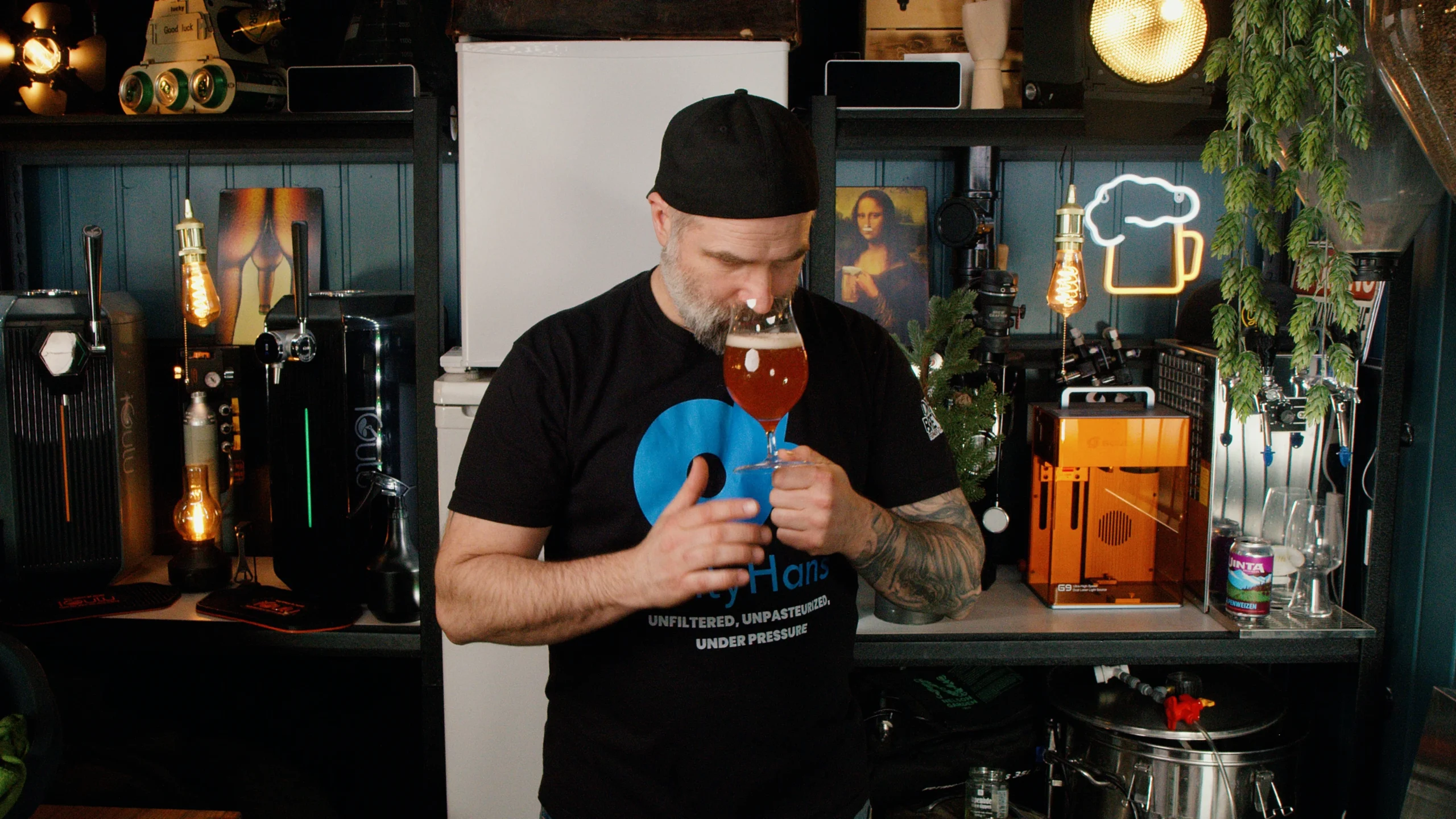 Man smelling wheat beer in glass checking aroma and character